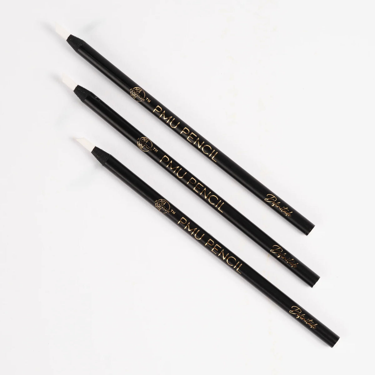 Set of three black Definitude PMU Brow Pencils with gold branding, designed for precise eyebrow mapping and outlining, displayed on a white background.