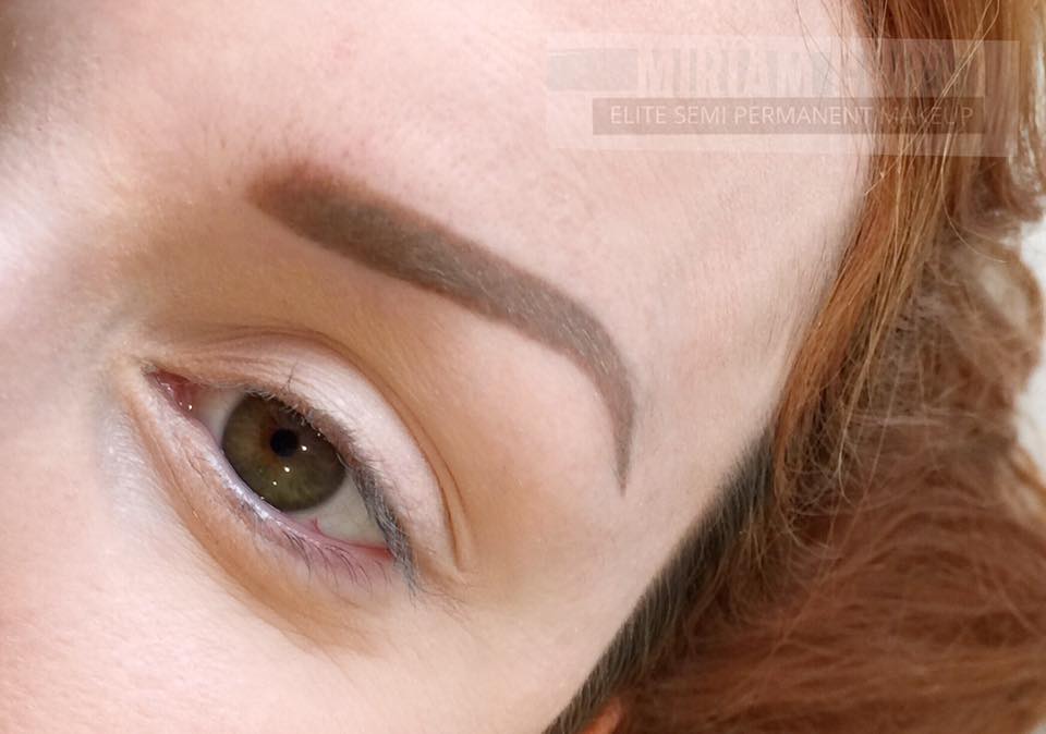 Healed result of Milk Chocolate PMU brow correction by artist Miriam Grice, showing smooth even color correction over old gray strokes with soft brown tones.