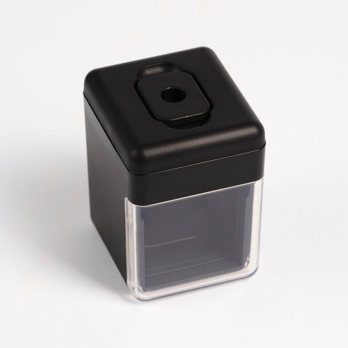 Pendulum PMU pencil sharpener with a sleek black design and clear top, displayed on a white background.