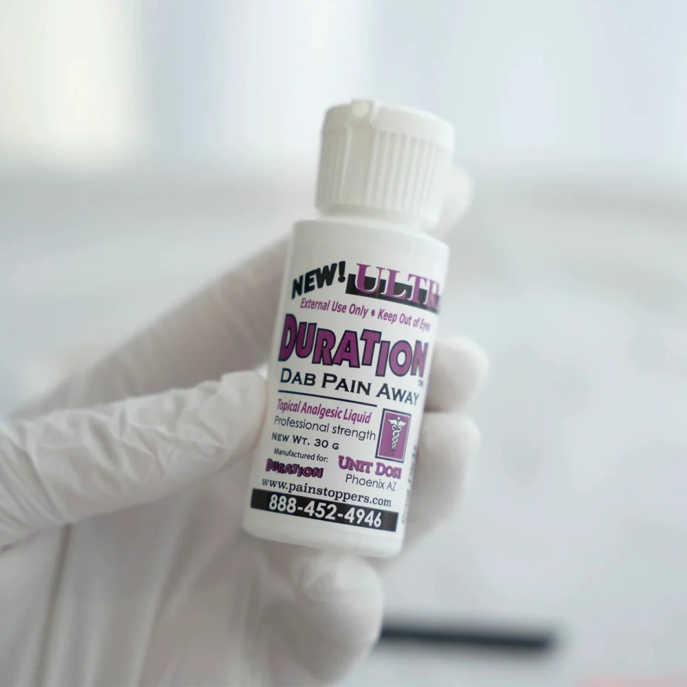 Applying Ultra Duration Liquid Secondary Numbing during permanent makeup procedure